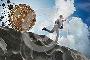 The bitcoin chasing businessman in cryptocurrency blockchain concept