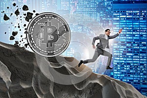 The bitcoin chasing businessman in cryptocurrency blockchain concept