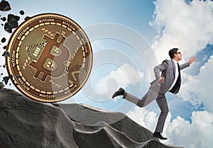 Bitcoin chasing businessman in cryptocurrency blockchain concept