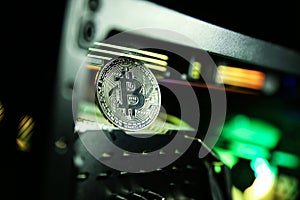 Bitcoin coin on the background of mining farm