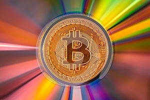 Bitcoin coin on a CD - DVD, background for design