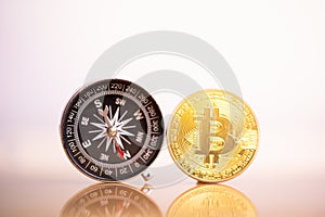 Bitcoin coin and compass.