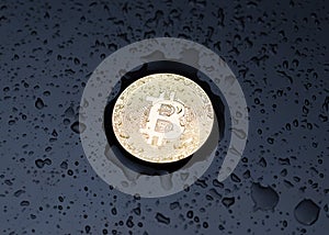 Bitcoin coin on a dark background