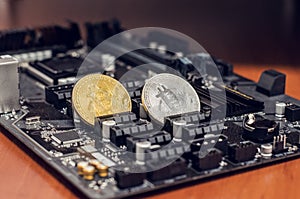 Bitcoin coin on the equipment for mining cryptocurrency. Modern business. The collapse of the financial system