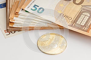 Bitcoin coin and Euro banknotes