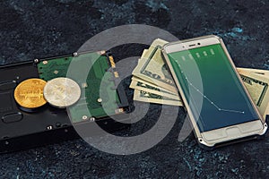 Bitcoin coin with HDD money and smartphone