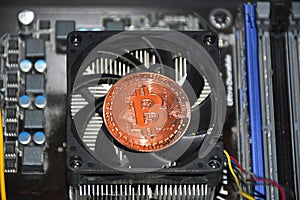 Bitcoin coin inside the computer system unit. blockchain