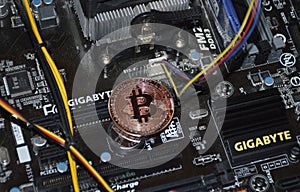 Bitcoin coin inside the computer system unit. blockchain