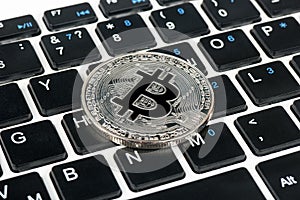 Bitcoin coin on keyboard