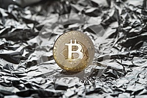 Bitcoin coin symbol in silver background