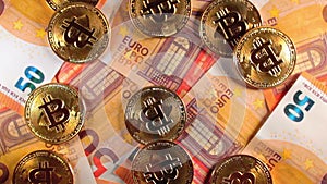 Bitcoin Coins on the 50 Euro Banknotes - Top View