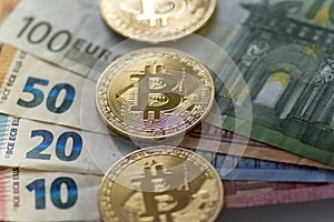 Bitcoin coins on euro background - Stock image