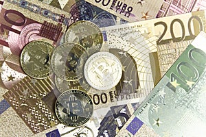 Bitcoin coins on euro banknotes