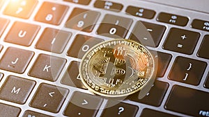 Bitcoin coins are placed on laptop computer keyboards. Cryptocurrency gold bitcoin coin, blockchain technology, Finance and