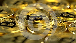 Bitcoin coins spin in a circle and shimmer. Close up