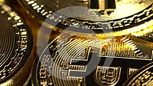 Bitcoin coins spin on the table