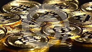 Bitcoin coins spin on the table