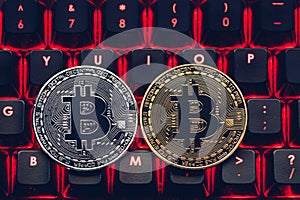 Bitcoin on compuer keyboard in background, symbol of electronic virtual money and mining cryptocurrency concept. Coin crypto