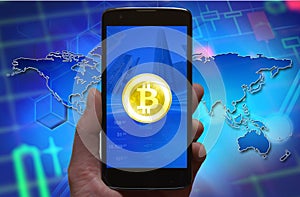 Bitcoin concept wallpaper. Cryptocurrency Bitcoin symbol at smartphone screen, phone in the hand.