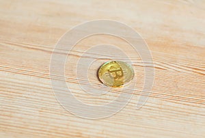 Bitcoin crypto currency on wooden background.