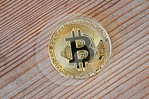 Bitcoin crypto currency on wooden background.