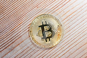 Bitcoin crypto currency on wooden background.