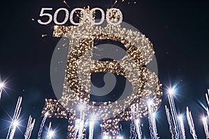Bitcoin crypto symbol with Fireworks in the sky and 50000 above