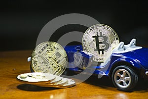 Bitcoin cryptocurrency and blue concept car