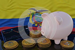 Bitcoin and cryptocurrency investing. Ecuador flag in background. Piggy bank, the of saving concept. Mobile application for