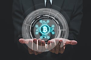 Bitcoin cryptocurrency, Person hand holding bitcoin icon with city scape bokeh background, Financial technology