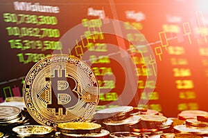 Bitcoin cryptocurrency stock trading background concept. Golden bitcoin over many international money coins with abstract trading