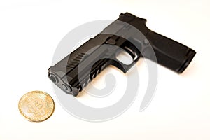 Bitcoin cryptocurrency under a pointing gun theft