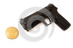 Bitcoin cryptocurrency under a pointing gun theft