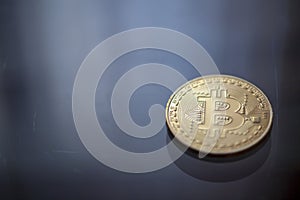Bitcoin curency DOF on blue light background