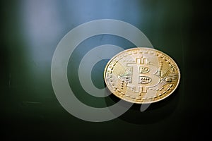 Bitcoin curency on green light background