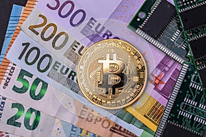 A bitcoin currency near the micro-schemes, photo