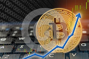 Bitcoin currency rising arrow price record highs on keyboard computer with golden bitcoin and other currencies.