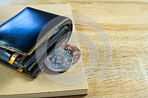 Bitcoin digital currency instead real money, bit-coin with leather wallet or purse on wooden working table, virtual