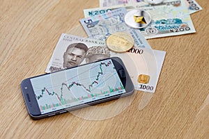 Bitcoin, ethereum, banknotes, and smartphone with photo