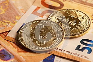 Bitcoin and euro banknotes