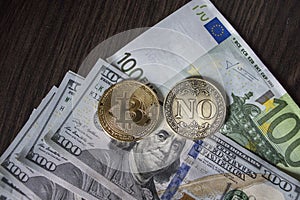 Bitcoin, Euro and dollars on the table with a Coin `No`