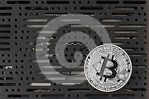 Bitcoin in front of computer board