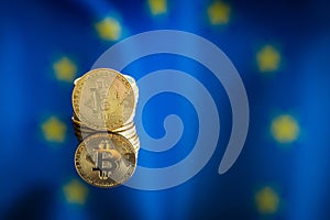 Bitcoin in front of Europe union flag. Digital cryptocurrency