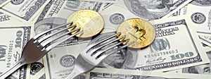 Bitcoin getting New Hard Fork Change, Physical Golden Crytocurrency Coin under the fork on the dollars background. Blockchain Tra