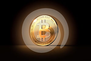 Bitcoin Gold BTG on gently lit background with copy space - as the result of latest Bitcoin`s Hard Fork