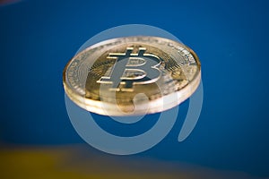 Bitcoin gold coin close up macro shot