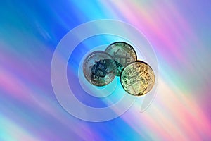 Bitcoin gold coin on holographic colors background