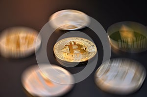 bitcoin gold coin with other digital crypto currencies coins out of focus