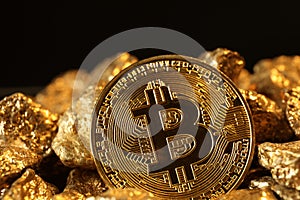 Bitcoin and gold nuggets on black background, closeup