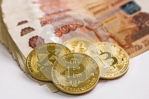 Bitcoin gold and the Russian ruble. Bitcoin coin on the background of Russian rubles.